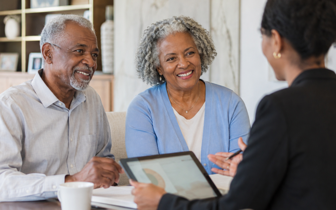 Older couple meeting with a professional advisor to discuss plans for their next move.
